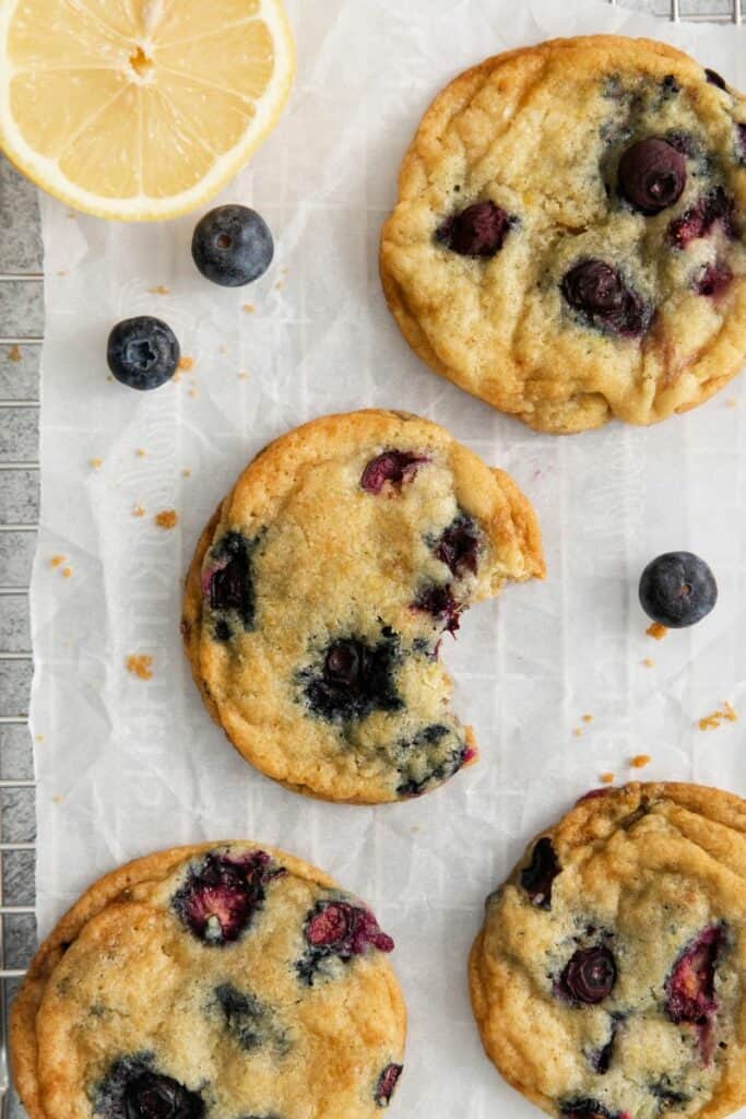 Lemon  Blueberry Cookies with a bite eaten out of one
