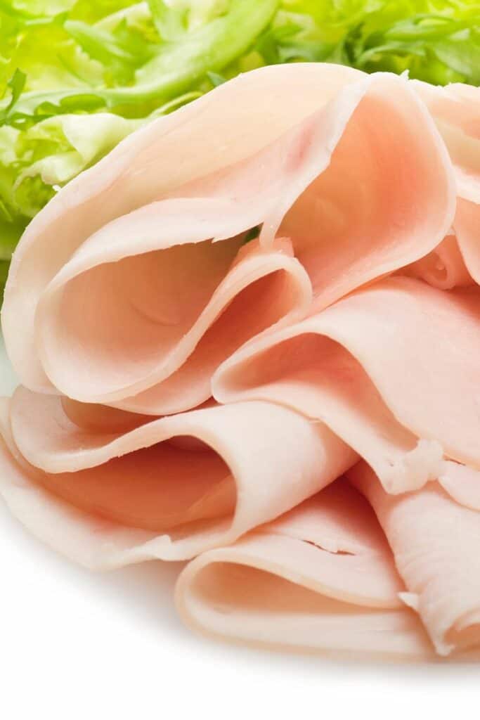 Thinly sliced deli turkey close up